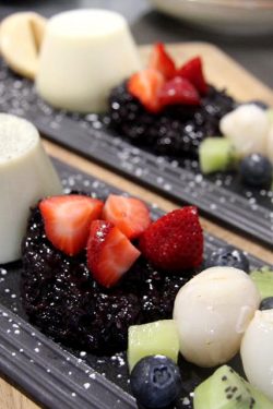 Coconut panna cotta with sweet black sticky rice and fresh fruit